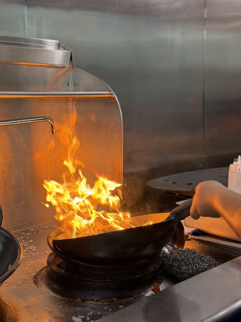 Wok flames at the Mahek kitchen