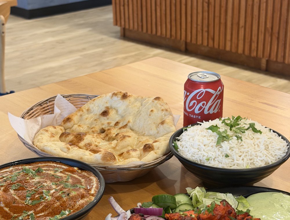 A spread of curry, rice and naan