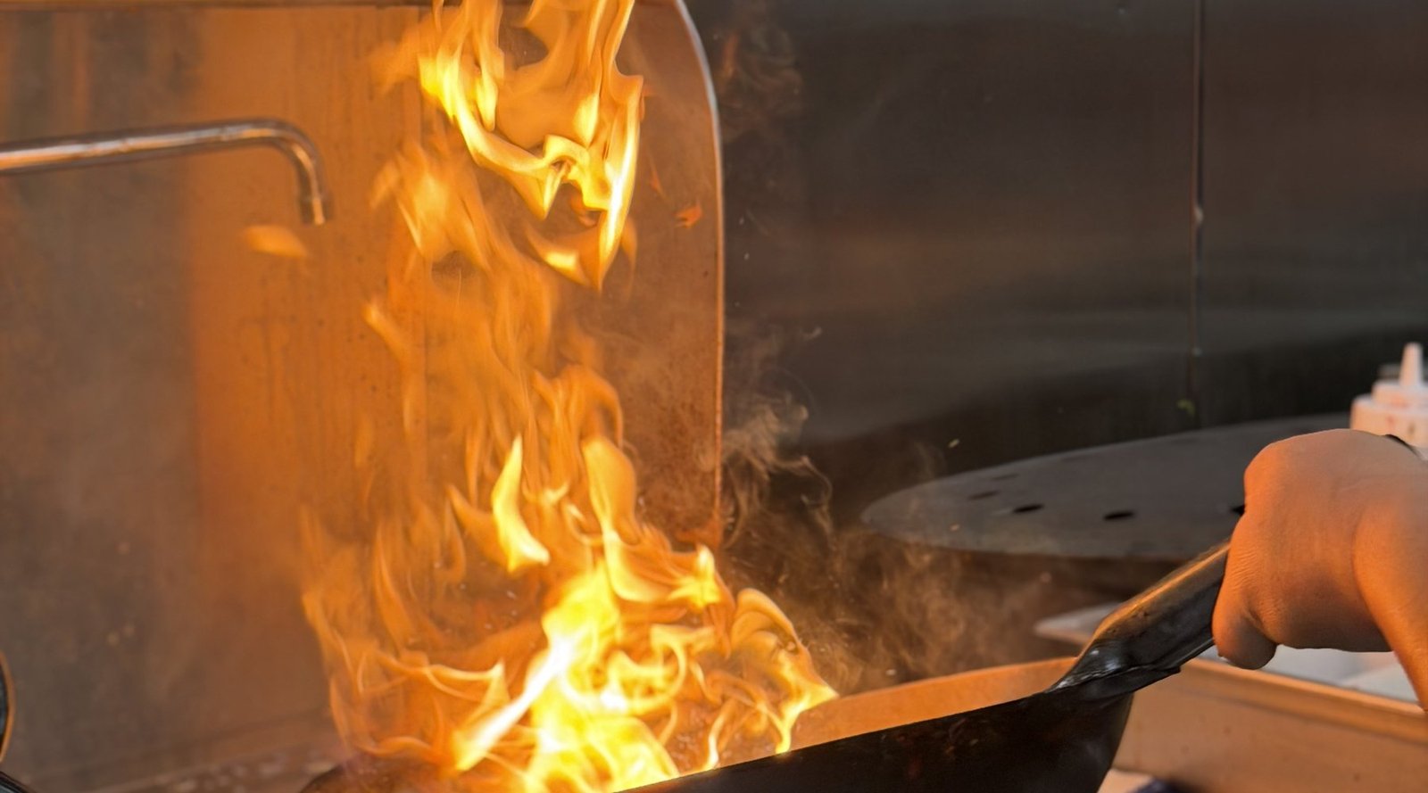 Wok flames at the Mahek kitchen